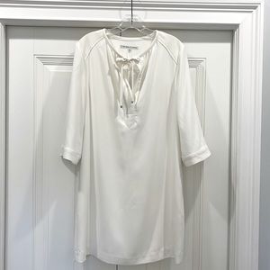 Trina Turk size 8 dress. Off white. Never been worn. Falls above knee.